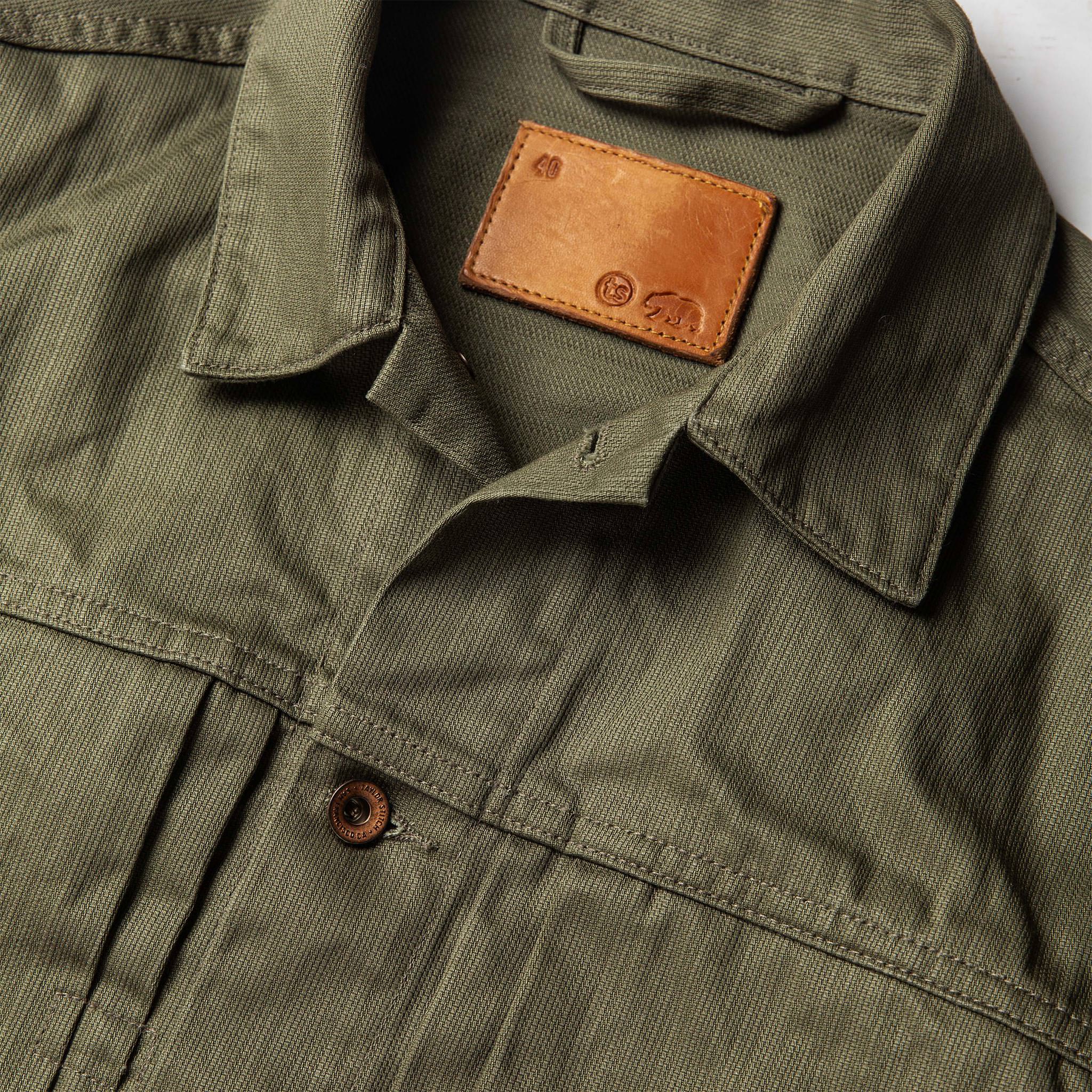 material shot of The Ryder Jacket in Yoshiwa Mills Olive showing interior label, Outerwear by Taylor Stitch