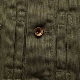 material shot of The Ryder Jacket in Yoshiwa Mills Olive highlighting front placket and button