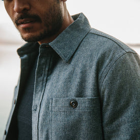 fit model wearing The Lined Utility Shirt in Indigo and Slate Twill looking down