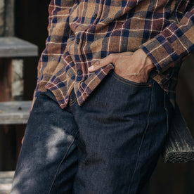 fit model with his hand in his pocket wearing The Democratic Jean in Cone Mills Cordura Denim
