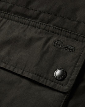 material shot of the pockets on The Ignition Vest in Coal Dry Wax, Outerwear by Taylor Stitch