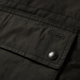 material shot of the pockets on The Ignition Vest in Coal Dry Wax