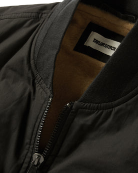 material shot of the collar and zipper on The Ignition Vest in Coal Dry Wax, Outerwear by Taylor Stitch