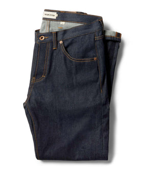 flatlay of The Slim Jean in Cone Mills Cordura Denim folded, Bottoms by Taylor Stitch