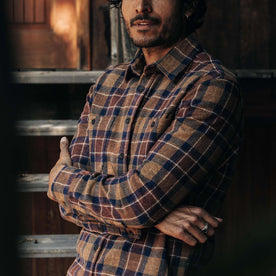 fit model with his arms folded in The Utility Shirt in Caramel Jaspe Herringbone Plaid