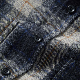 material shot of the buttons on The Utility Shirt in Navy Jaspe Herringbone Plaid
