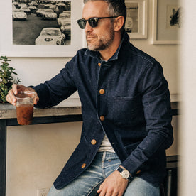 our fit model rocking The Ojai Jacket in Indigo Herringbone—sitting down drinking coffee