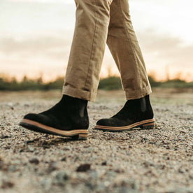 our fit model wearing The Ranch Boot in Coal Weatherproof Suede—walking left of screen