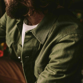 our fit model wearing The Long Haul Jacket in Washed Olive Herringbone