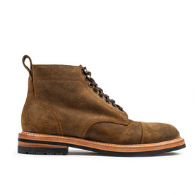 flatlay of The Moto Boot in Golden Brown Waxed Suede, shown from the side