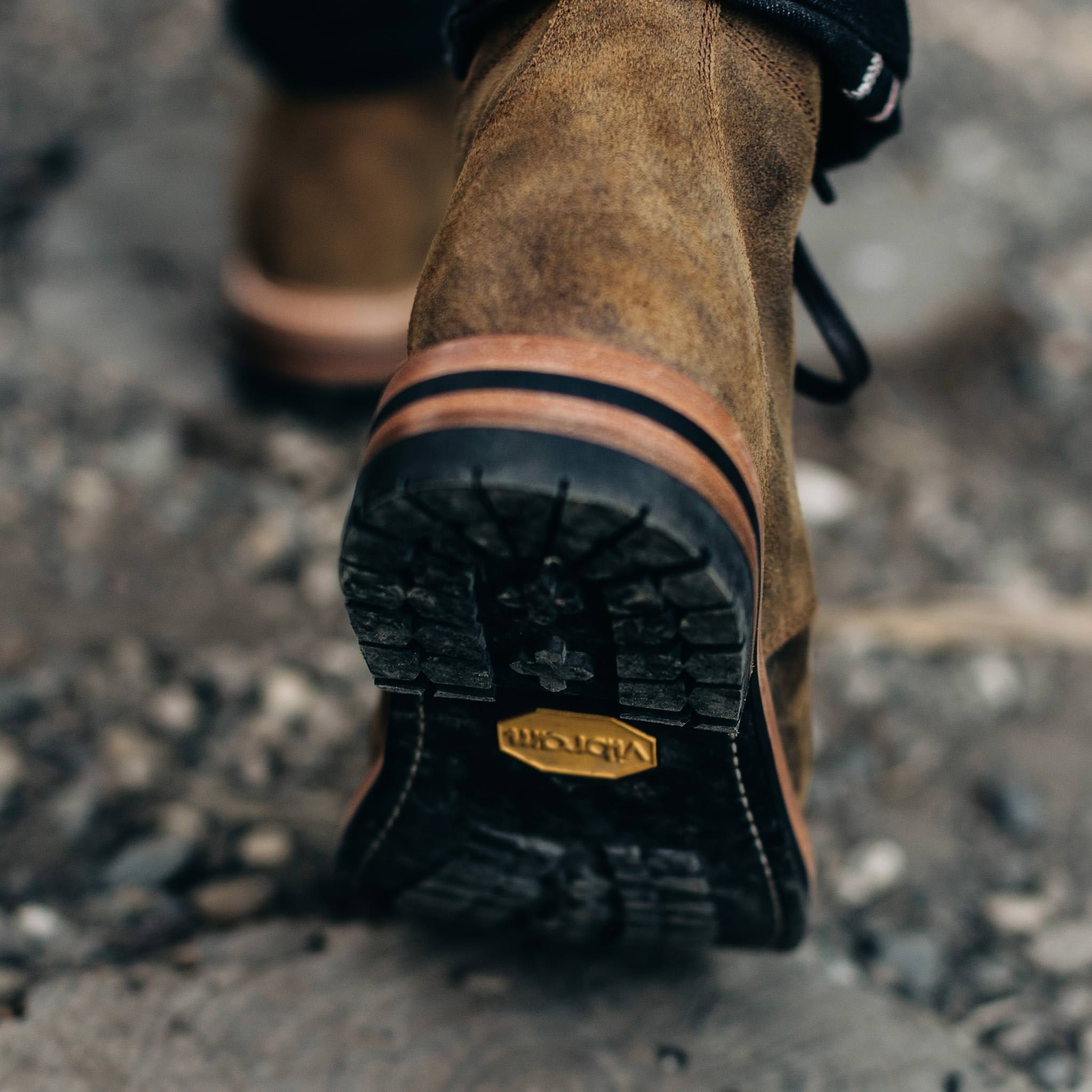 material shot of the soles on The Moto Boot in Golden Brown Waxed Suede, Footwear by Taylor Stitch