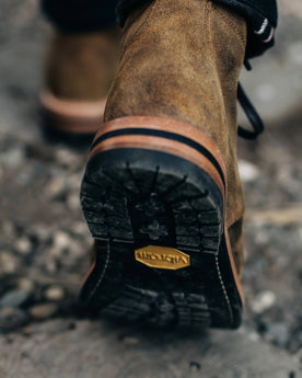 material shot of the soles on The Moto Boot in Golden Brown Waxed Suede, Footwear by Taylor Stitch