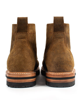 flatlay of The Moto Boot in Golden Brown Waxed Suede, shown from the back, Footwear by Taylor Stitch