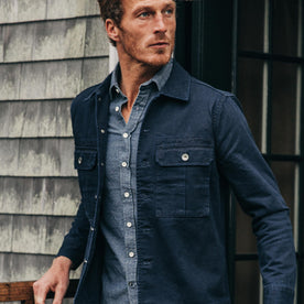 fit model wearing The HBT Jacket in Washed Navy, looking right