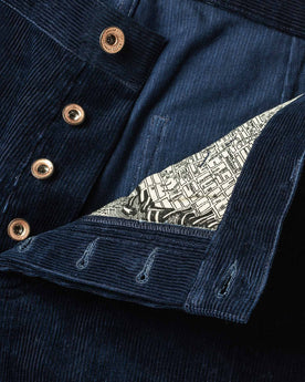 material shot of buttons and map interior , Bottoms by Taylor Stitch