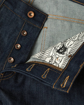 material shot of buttons and map interior , Denim by Taylor Stitch