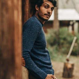 our fit model wearing The Hardtack Sweater in Navy Donegal—model looking over right shoulder with hand in pocket