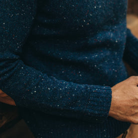 our fit model wearing The Hardtack Sweater in Navy Donegal—close up of right sleeve with cuff visible