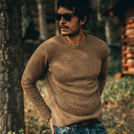 our fit model wearing The Hardtack Sweater in Oak Donegal—looking over right shoulder