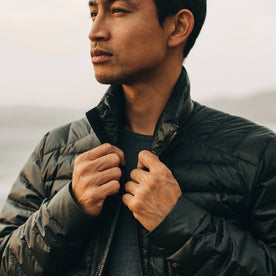our fit model wearing The Taylor Stitch x Mission Workshop Farallon Jacket in Black—cropped shot of chest