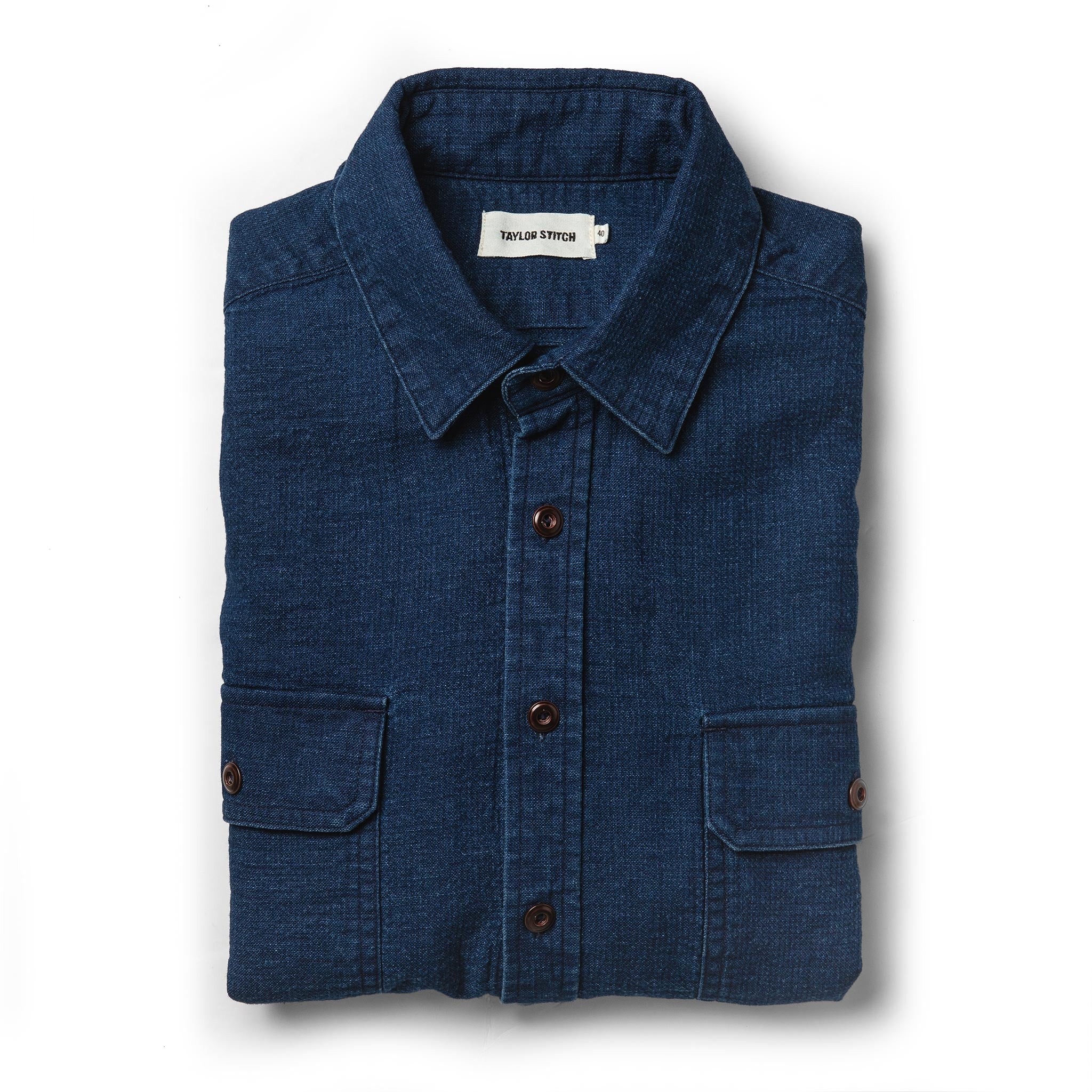 flatlay of The Corso Shirt in Indigo Double Cloth from the front folded up, Wovens by Taylor Stitch