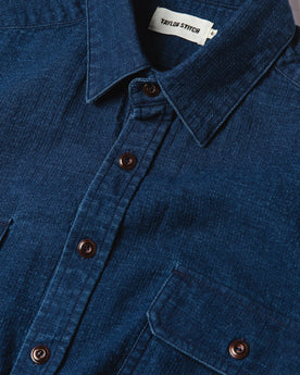 material shot of The Corso Shirt in Indigo Double Cloth from the front showing placket, collar, and chest pockets, Wovens by Taylor Stitch