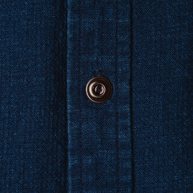 material shot of The Corso Shirt in Indigo Double Cloth close up of the horn button of the placket