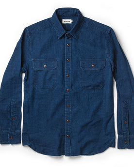 flatlay of The Corso Shirt in Indigo Double Cloth from the front with sleeves unfolded and visible, Wovens by Taylor Stitch