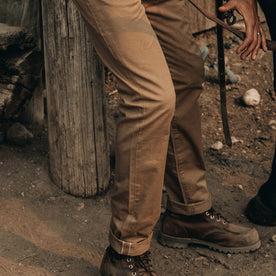 fit model wearing The Slim All Day Pant in Rustic Oak Organic Selvage, thigh down