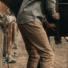 fit model wearing The Slim All Day Pant in Rustic Oak Organic Selvage, back/side shot