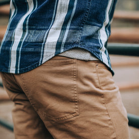 fit model wearing The Democratic All Day Pant in Rustic Oak Organic Selvage, back pocket