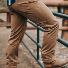 fit model wearing The Democratic All Day Pant in Rustic Oak Organic Selvage, side