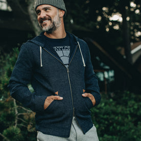 our fit model rocking The Après Hoodie in Indigo Waffle—outside, smiling