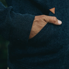 our fit model rocking The Après Hoodie in Indigo Waffle—cropped shot of hand in pocket